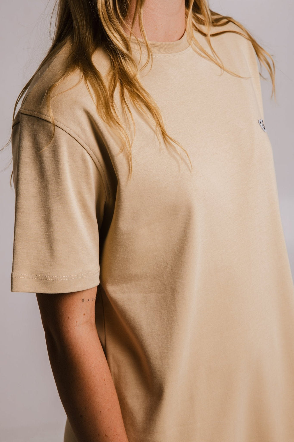 4. Side view close-up of Sossu's light brown Panda Heavy T-shirt showing sleeve detail