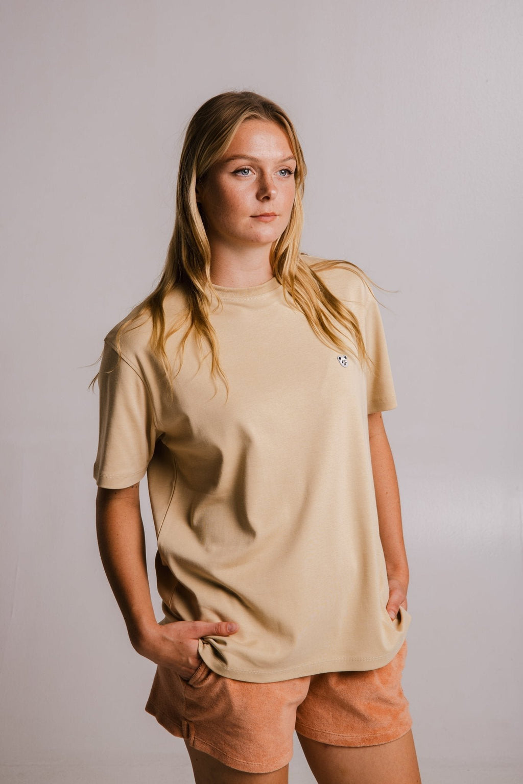 1. Women's Panda Heavy T-shirt in light brown by Sossu, styled with shorts in a lifestyle setting