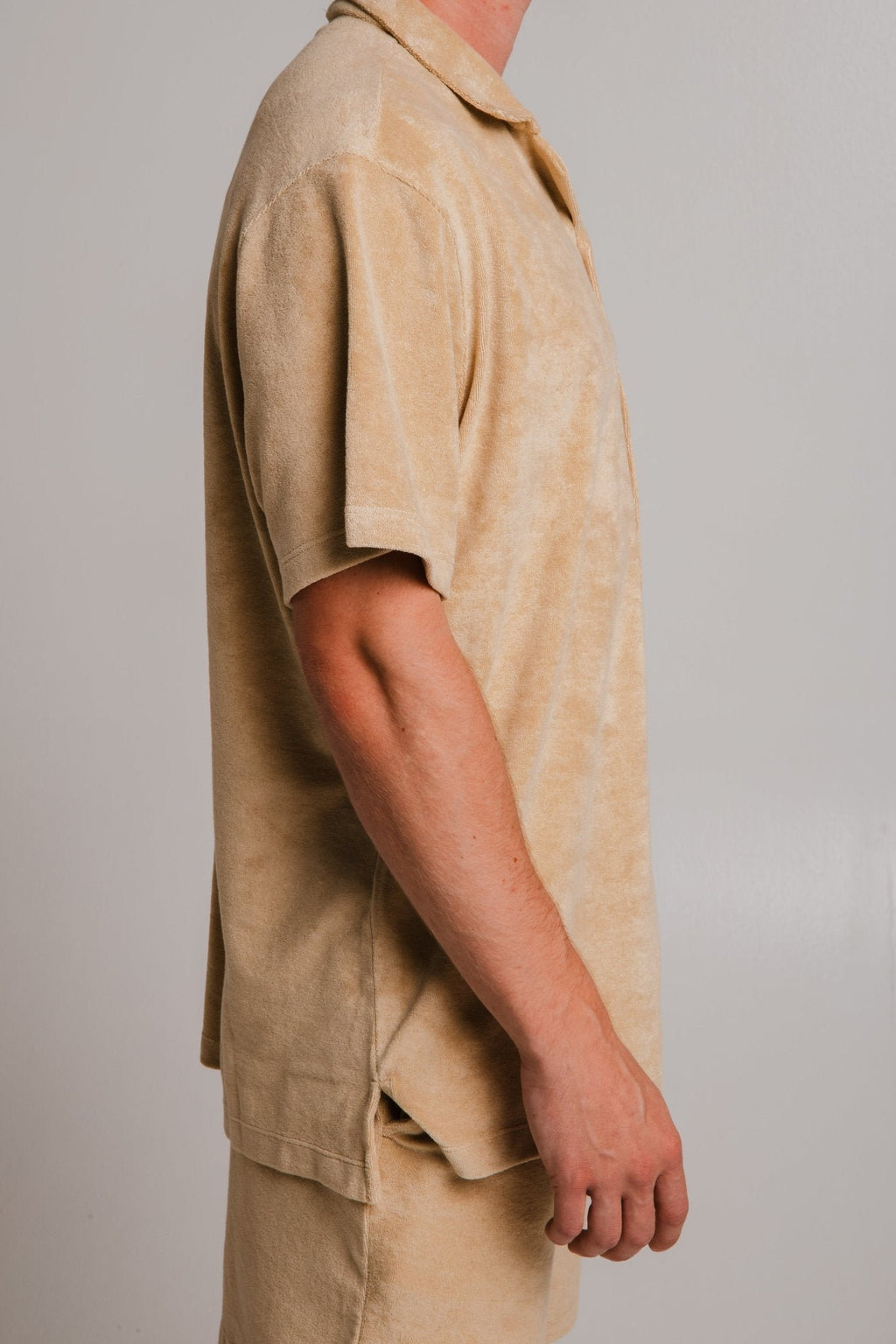 6. Side detail of unisex light brown Panda Terry Shirt by Sossu showing relaxed fit, studio setting