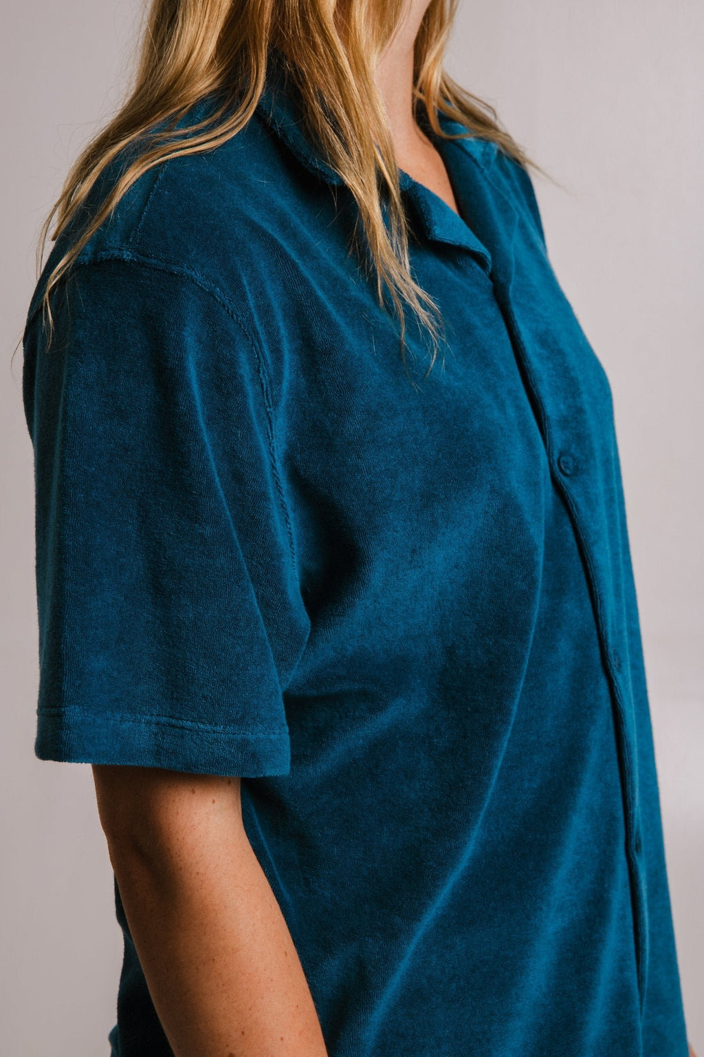 5. Side view of women's unisex navy blue Panda Terry Shirt by Sossu, showcasing relaxed fit and terry fabric