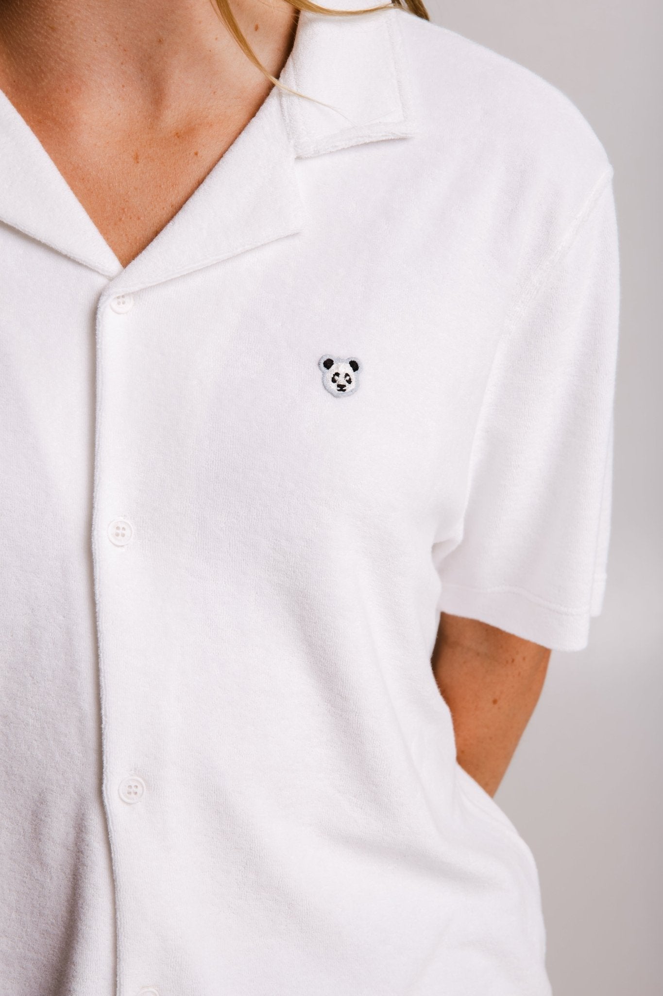 6. Close-up of embroidered panda detail on women's white Panda Terry Shirt by Sossu
