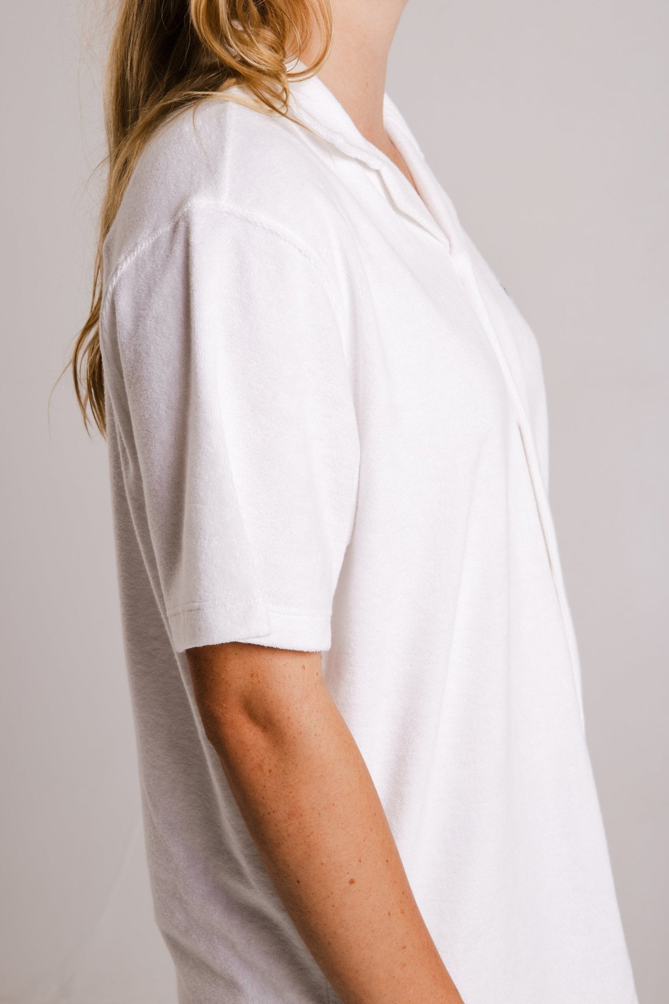 4. Side view of women's white Panda Terry Shirt by Sossu, showing short sleeves and relaxed fit