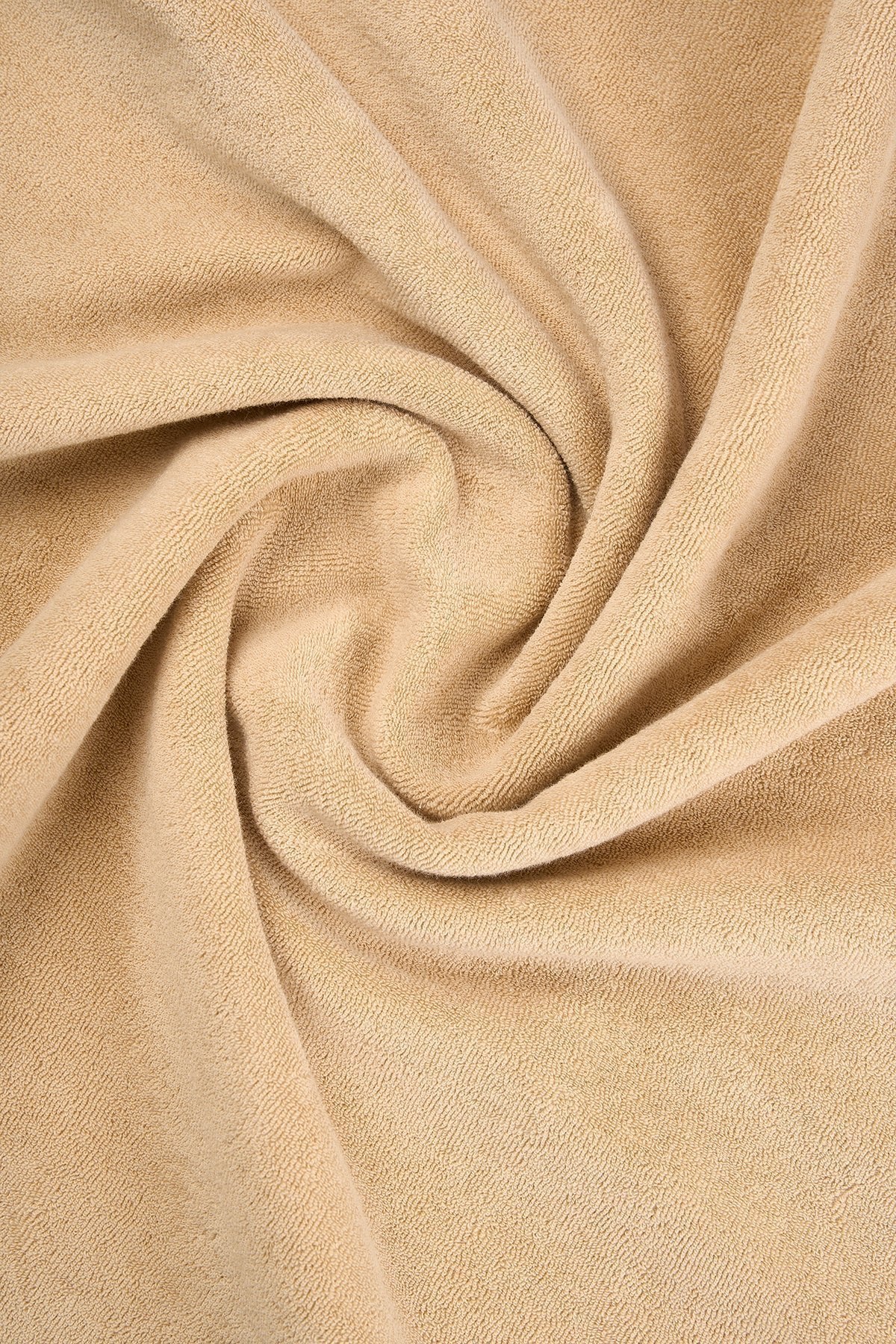 5. Close-up of light brown terry fabric texture of Sossu Panda T-shirt, showing material detail