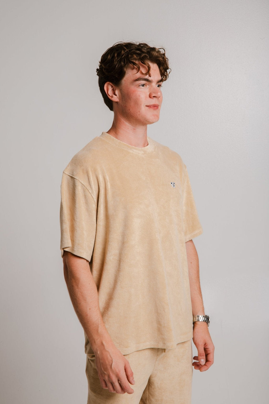4. Unisex light brown Panda Terry T-shirt by Sossu worn by male model, highlighting casual style