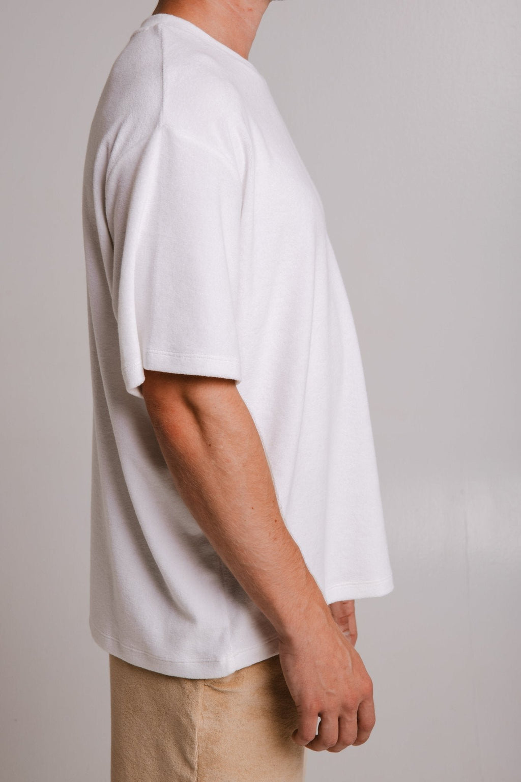 5. Side view of unisex white Panda Terry T-shirt by Sossu, highlighting relaxed fit