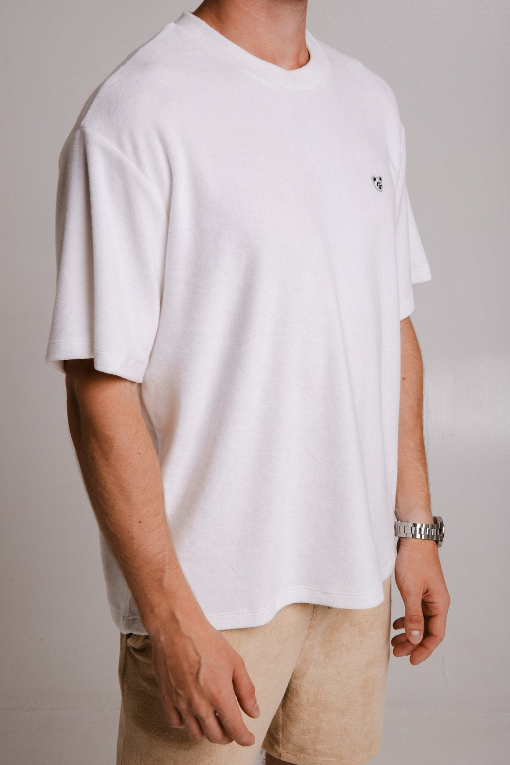 4. Unisex white Panda Terry T-shirt by Sossu, shown from the side