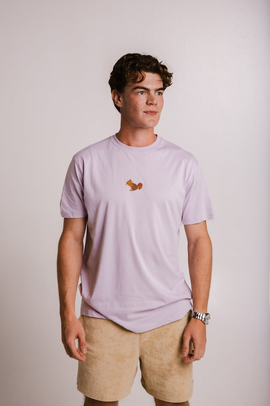 5. Men's lilac Sossu Squirrel T-shirt in studio, displaying front view and embroidered detail