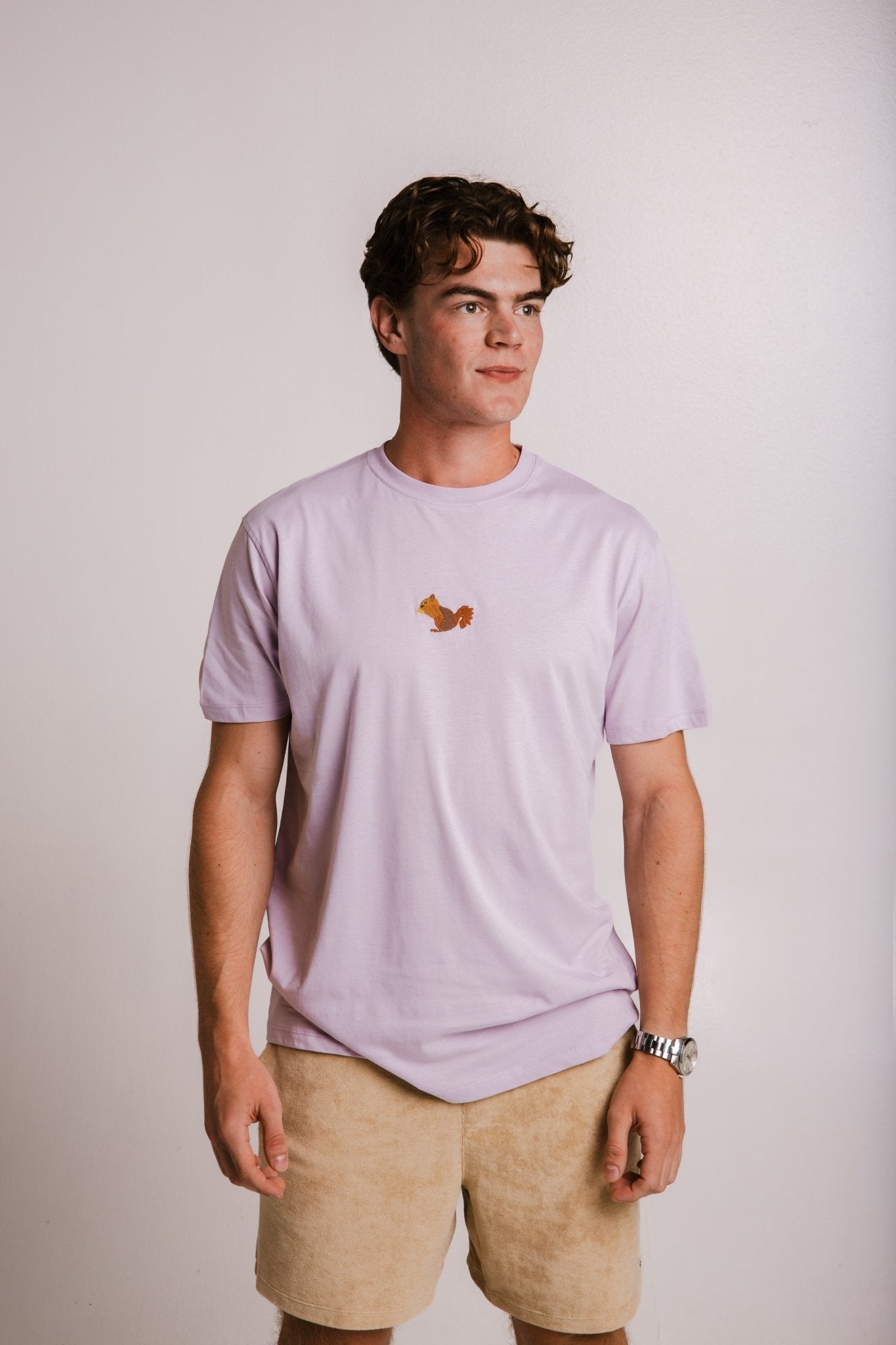 5. Men's lilac Sossu Squirrel T-shirt in studio, displaying front view and embroidered detail