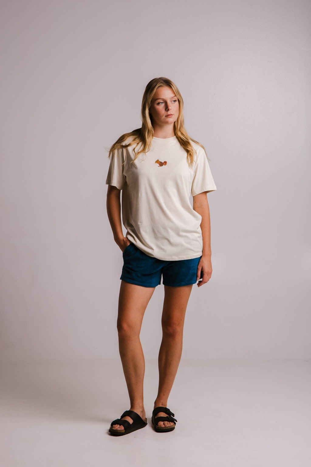 5. Full view of women's Sossu Squirrel T-shirt in Parchment, styled with shorts and sandals, studio setting