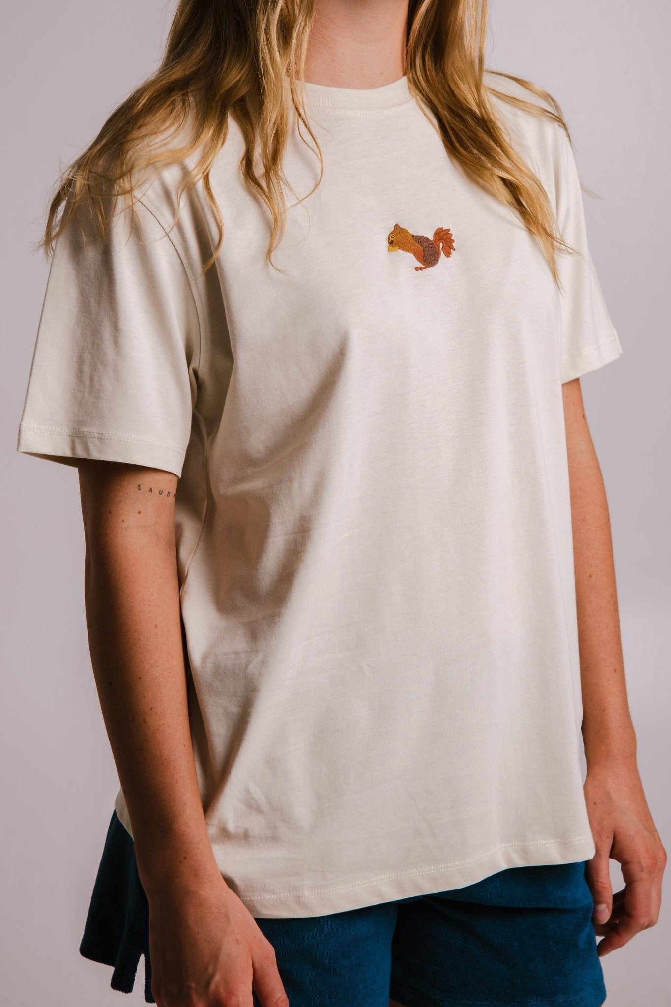 3. Close-up of Sossu Squirrel T-shirt in Parchment, showing embroidered design