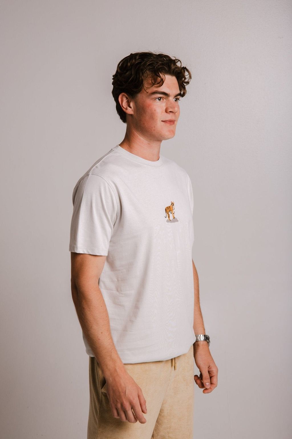 3. Men's grey Tiger T-shirt by Sossu, side view in studio setting