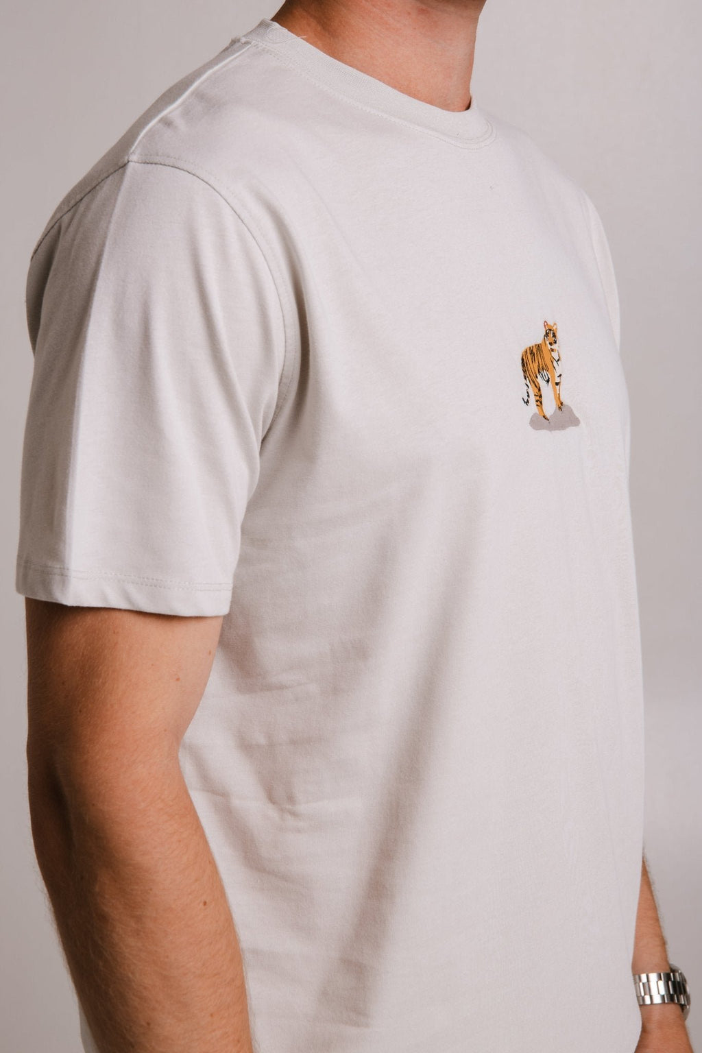 5. Men's grey Tiger T-shirt by Sossu, side view highlighting sleeve and fit