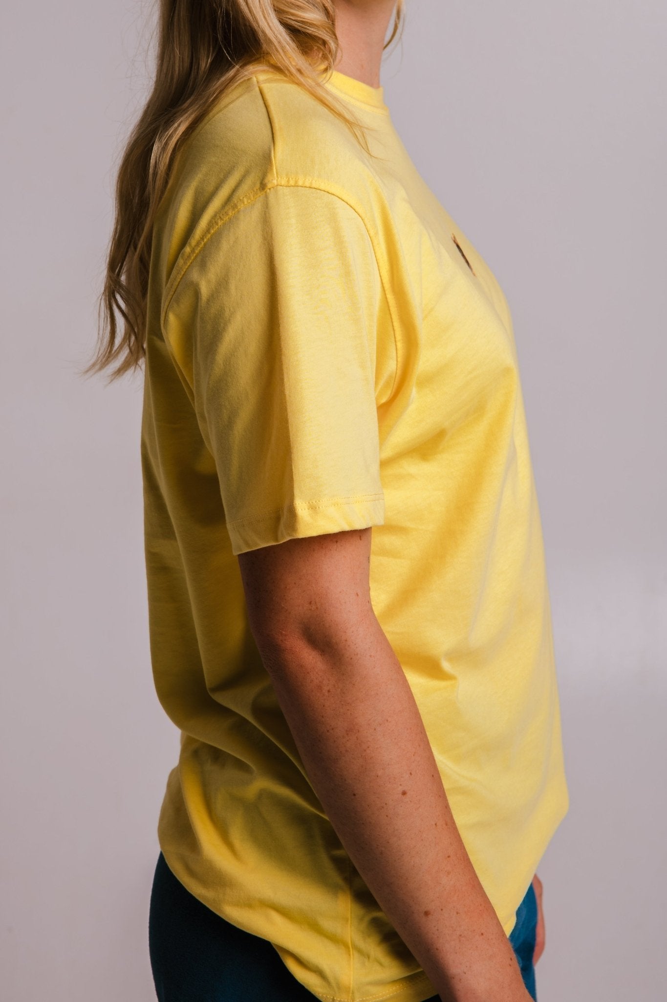 5. Side view of yellow Tiger T-shirt by Sossu, showing sleeve and fit details