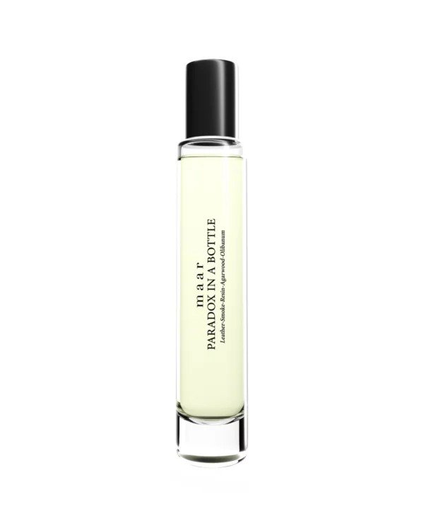 1. Tall glass bottle of maar Paradox In A Bottle perfume with black cap, featuring elegant label design