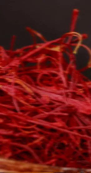 3. Close-up of red saffron threads, highlighting the rich spice element in the Temple of Sensus perfume