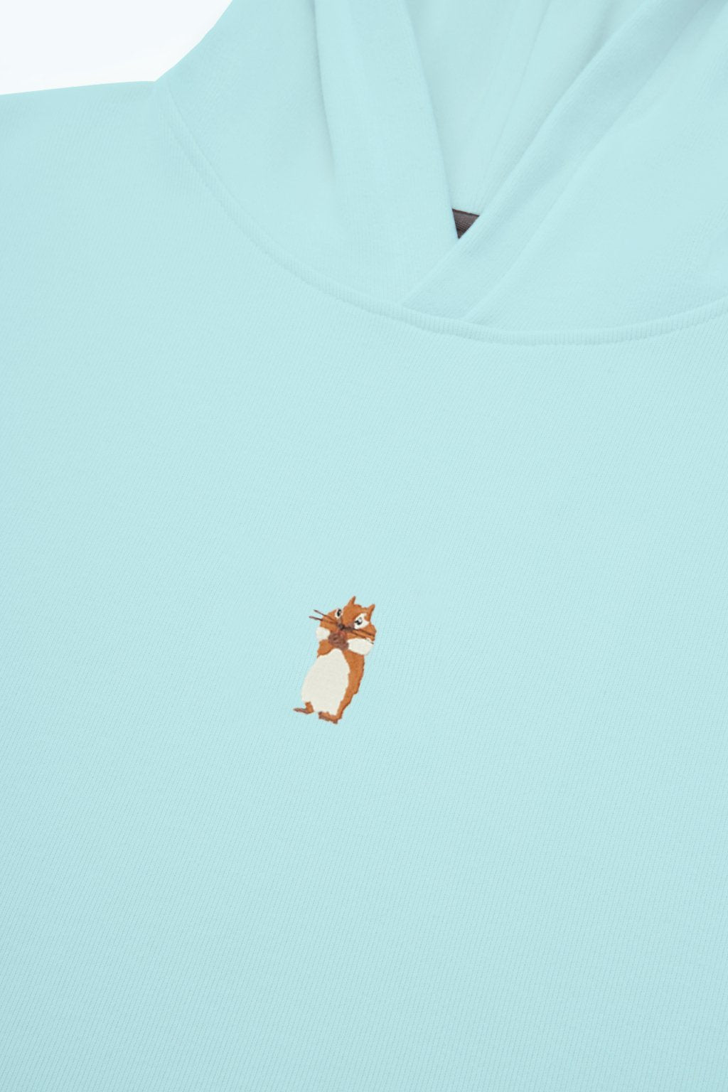 6. Close-up of embroidered squirrel detail on Sossu Squirrel Hoodie in mint
