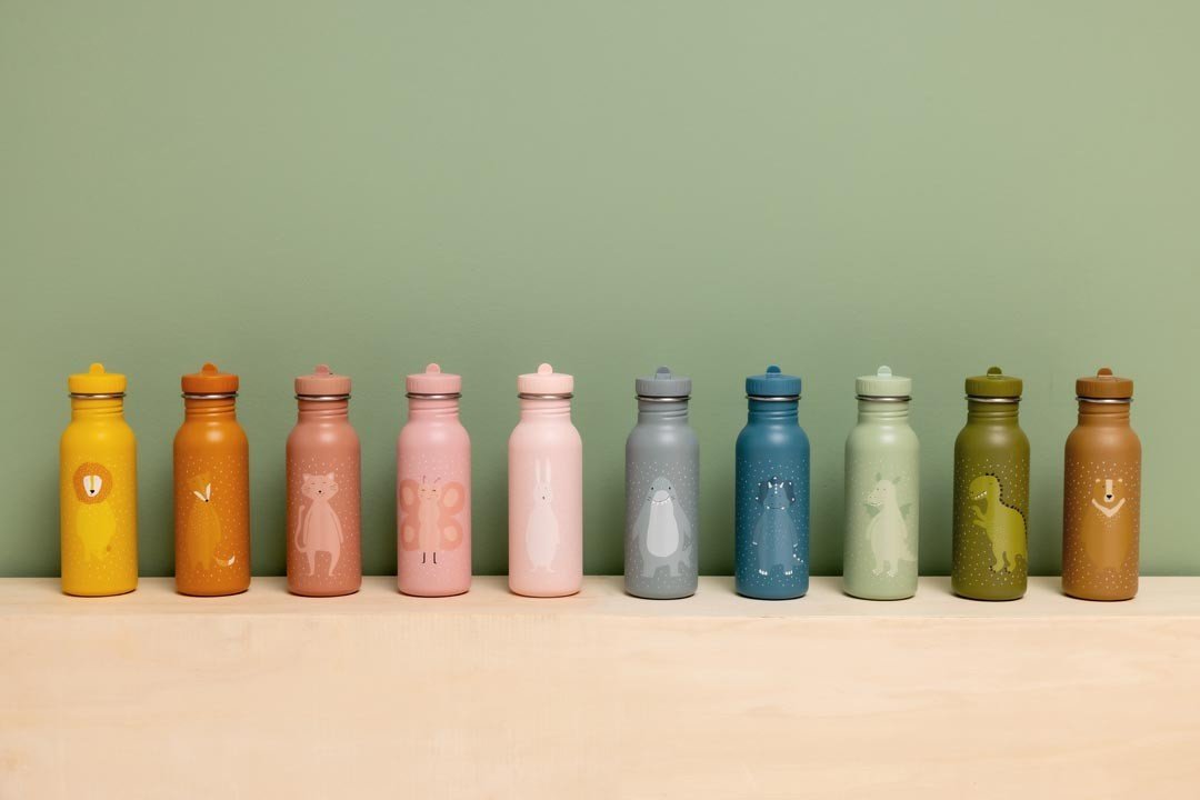 5. Ten Trixie Baby stainless steel bottles in assorted colors with animal illustrations, against green background
