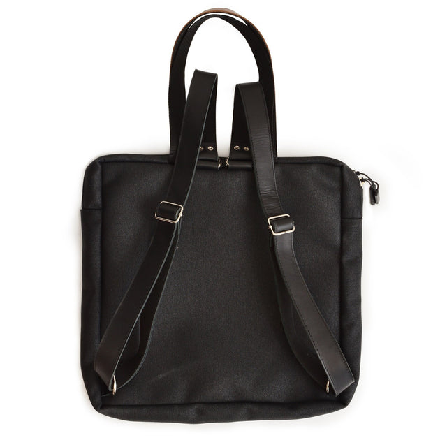 3. Back view of Stockholm Backpack in beige, showing adjustable straps and durable material