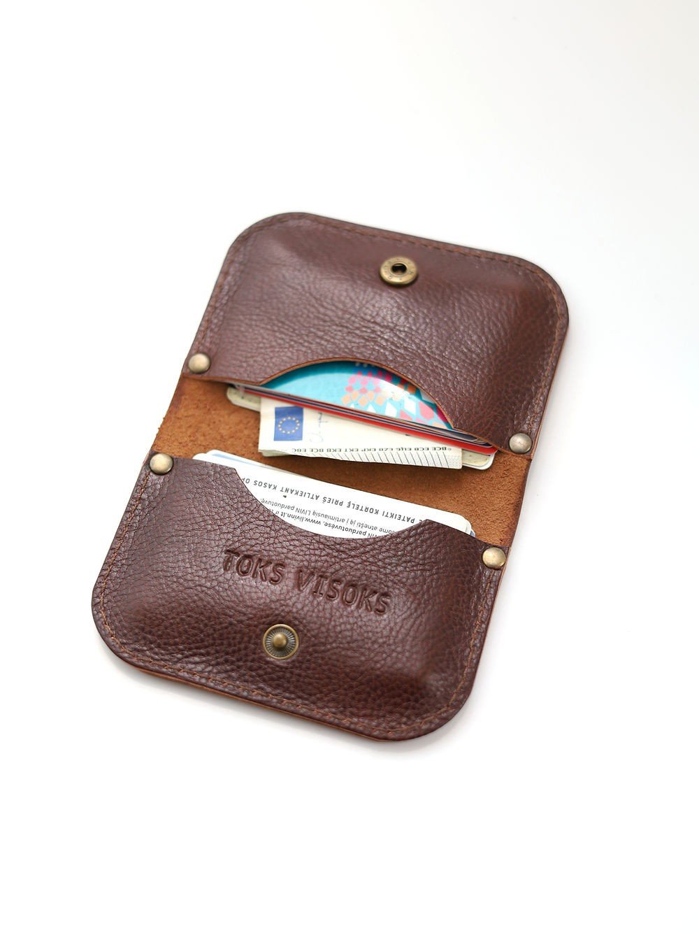 1. Open TOKS VISOKS SUNDAY wallet in marble brown leather showing multiple cards inside on white background