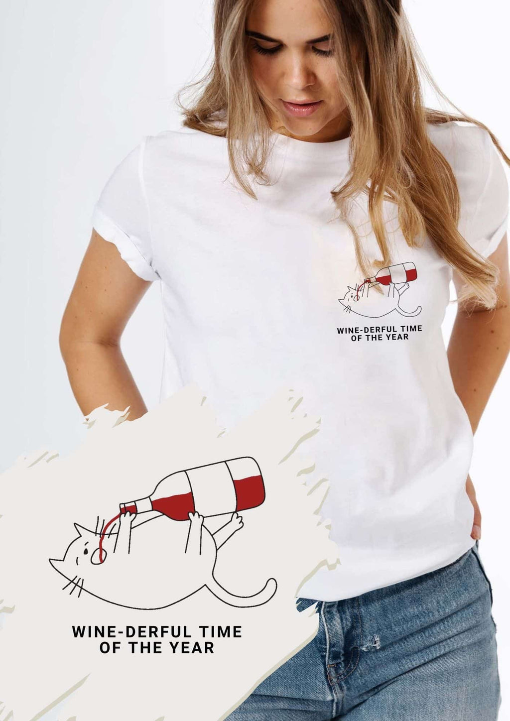 1. Woman wearing white Black Giraffe Brand T-shirt with 'Wine-derful Time of the Year' text and cat graphic, paired with blue jeans, in casual setting