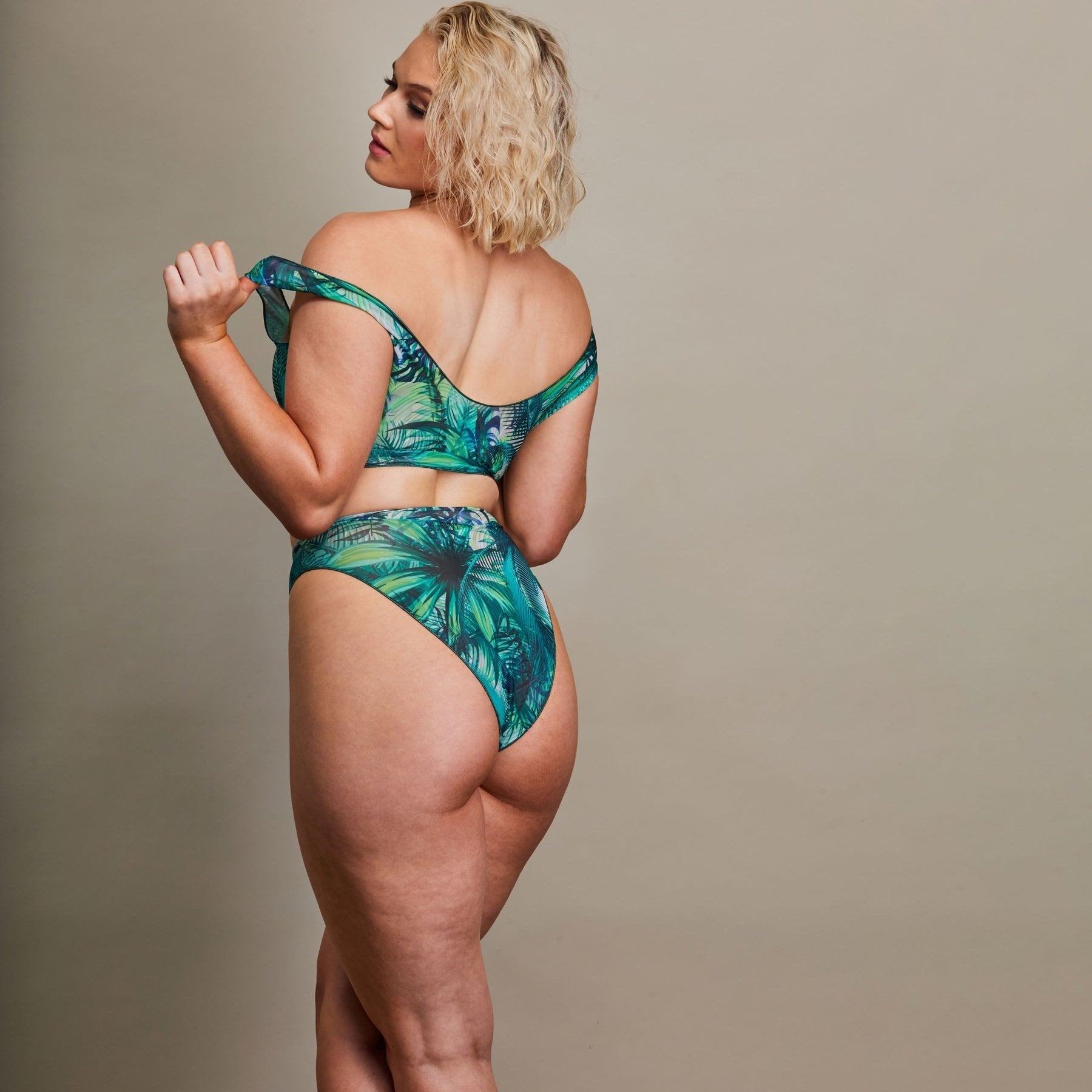 3. Back view of Women's Tropical Palm Green Tan Through Bikini Set by SWIMSARA, model in studio