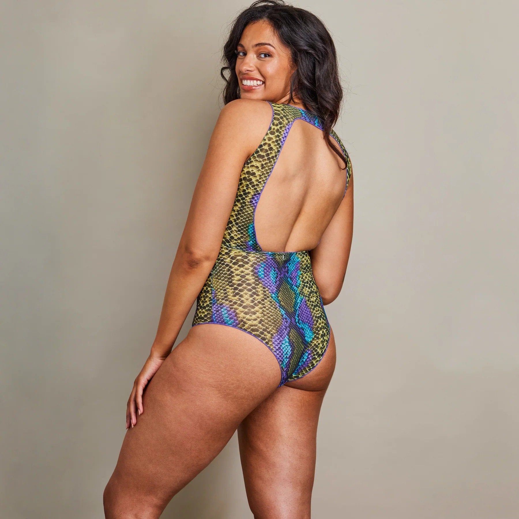 2. Women's tan-through fitted swimsuit The Paula by SWIMSARA in dark multi, shown from the back, highlighting open back design