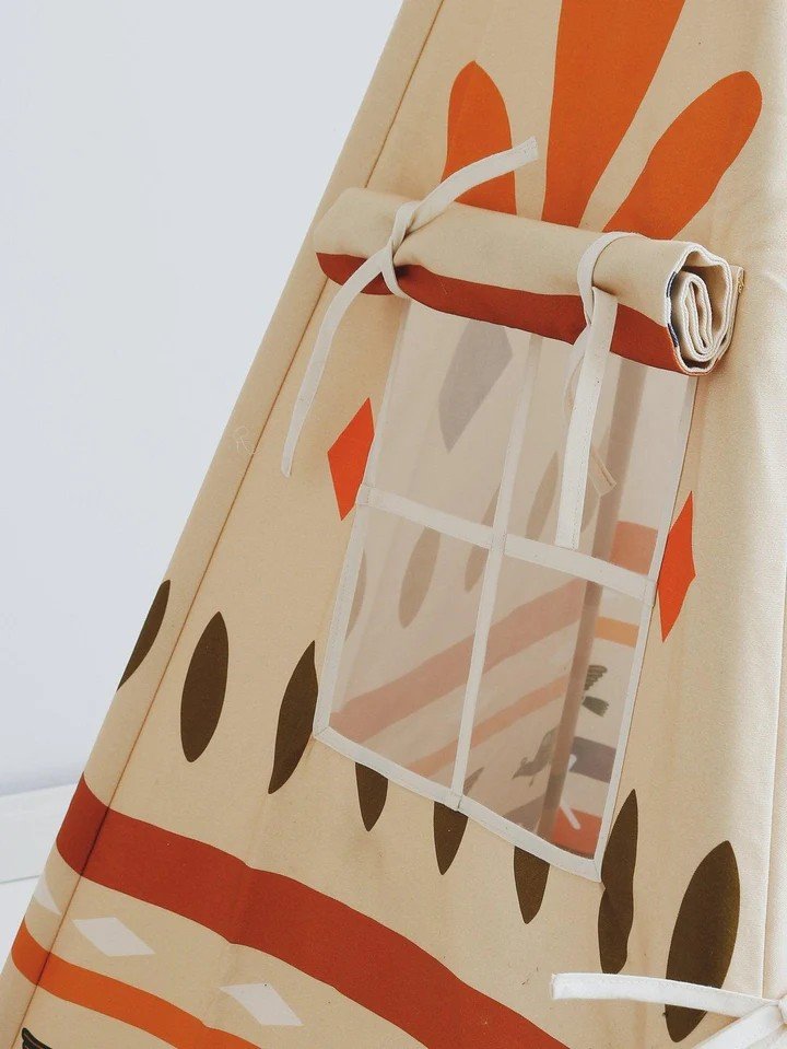 3. Close-up of teepee tent window with rolled-up fabric and geometric prints