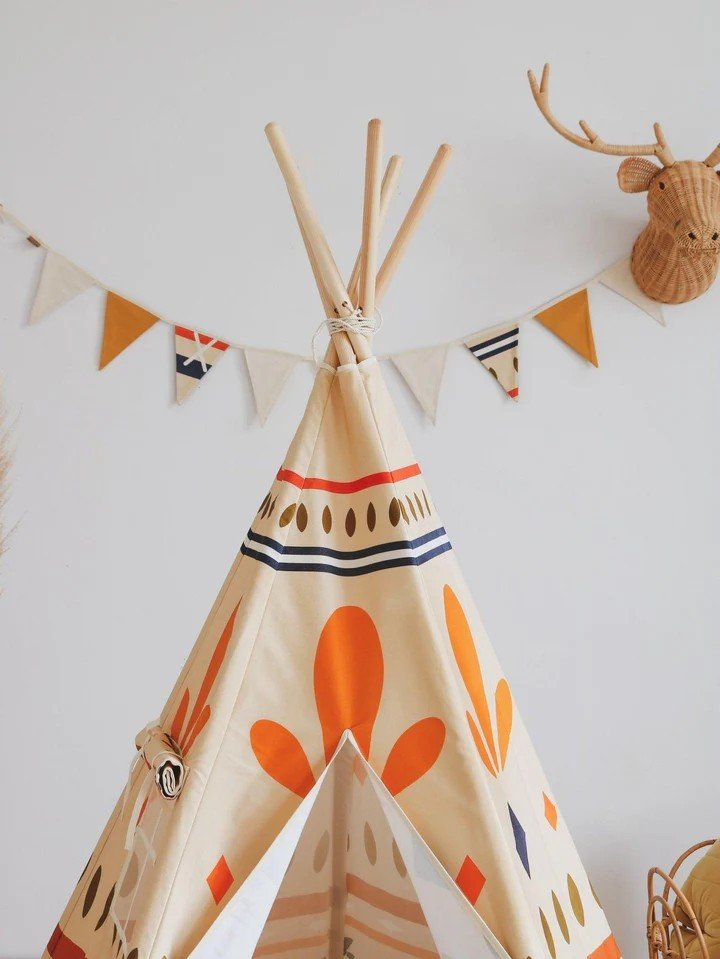 3. Close-up of the top section of Moi Mili teepee tent with geometric prints and bunting decoration