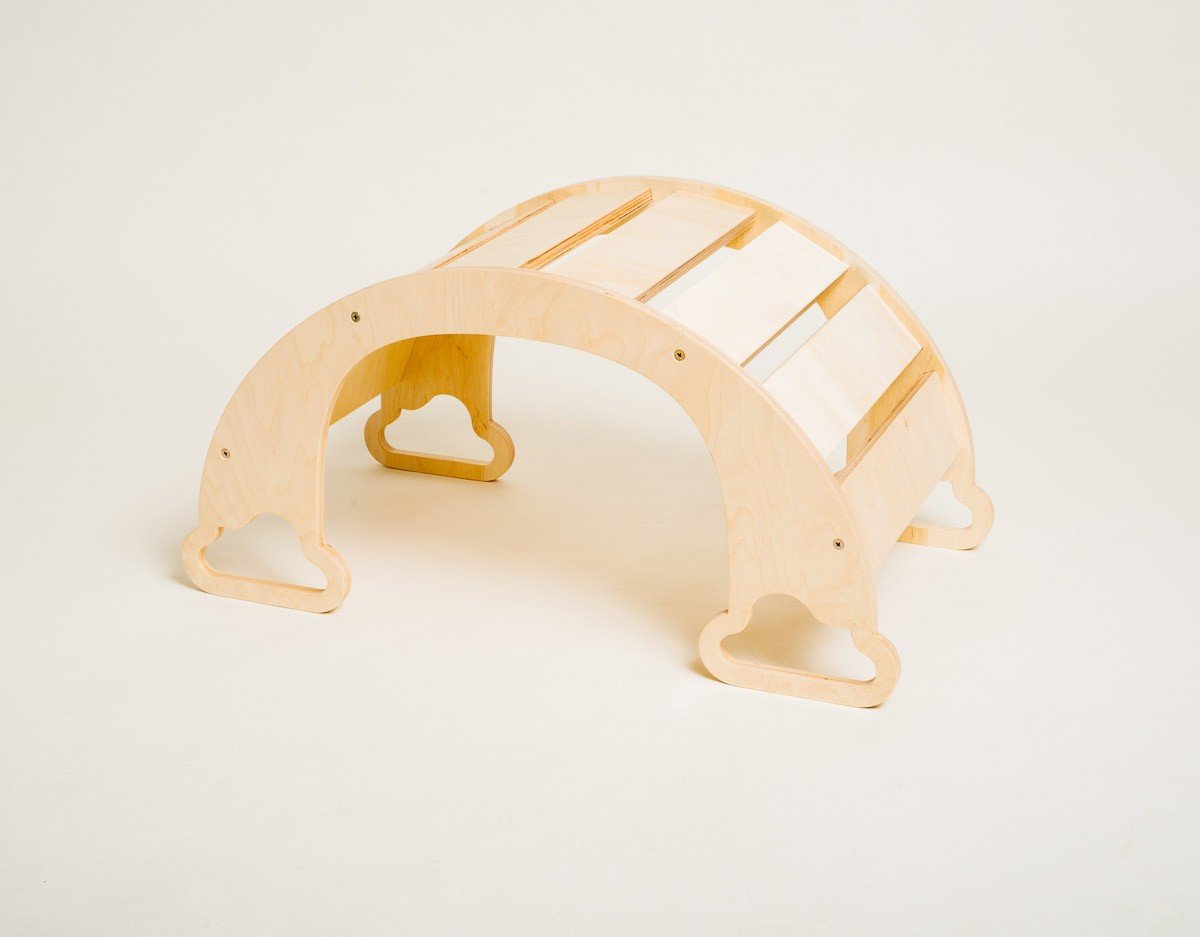 2. Side view of natural finish rainbow climber on a white background