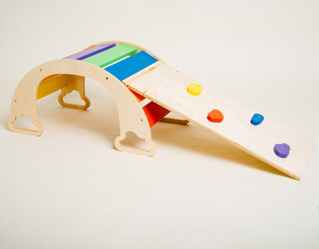 1. Sway Rainbow Ramp made of birch plywood with colorful climbing rocks on wooden floor