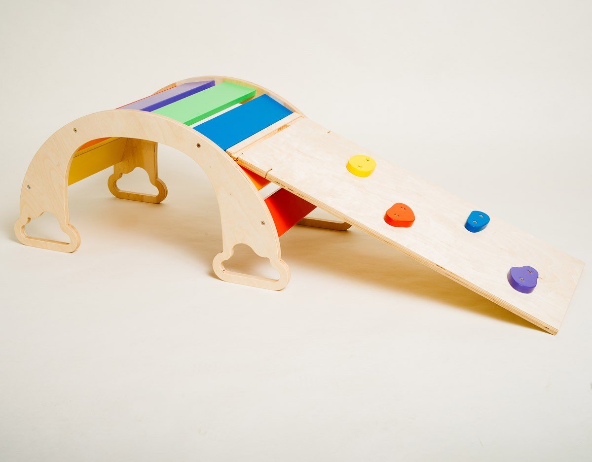 1. Sway Rainbow Ramp made of birch plywood with colorful climbing rocks on wooden floor