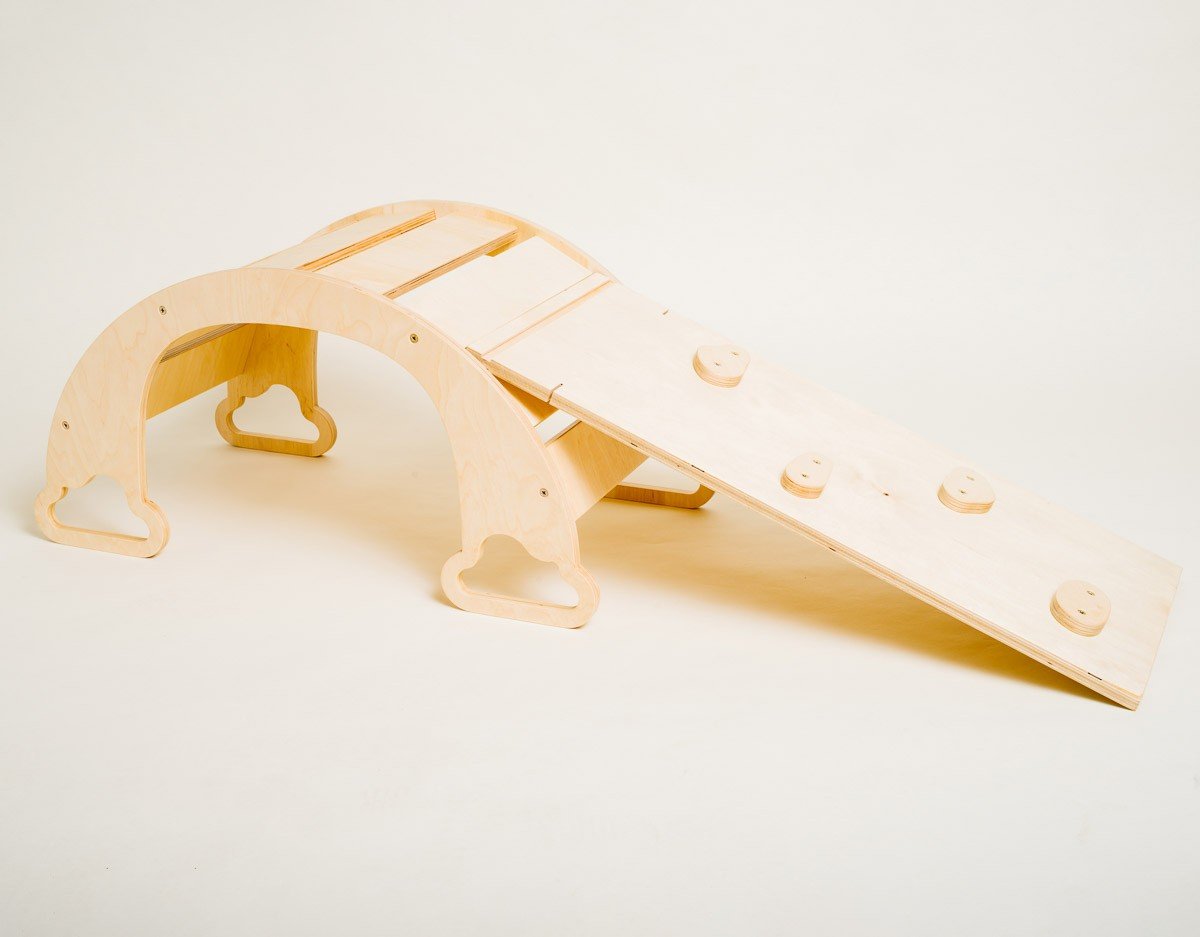 4. Sway Rainbow Ramp with natural wood finish and neutral climbing rocks on white background