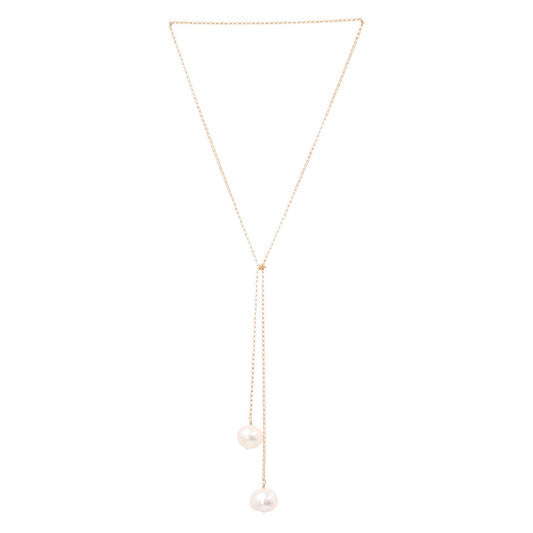 2. Studio image of TIED TO COCO - Pearl necklace by New Vintage by Kriss, showcasing two large pearls on a gold-filled chain