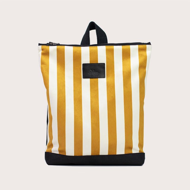 7. Studio shot of Muni striped mustard and white backpack with black base