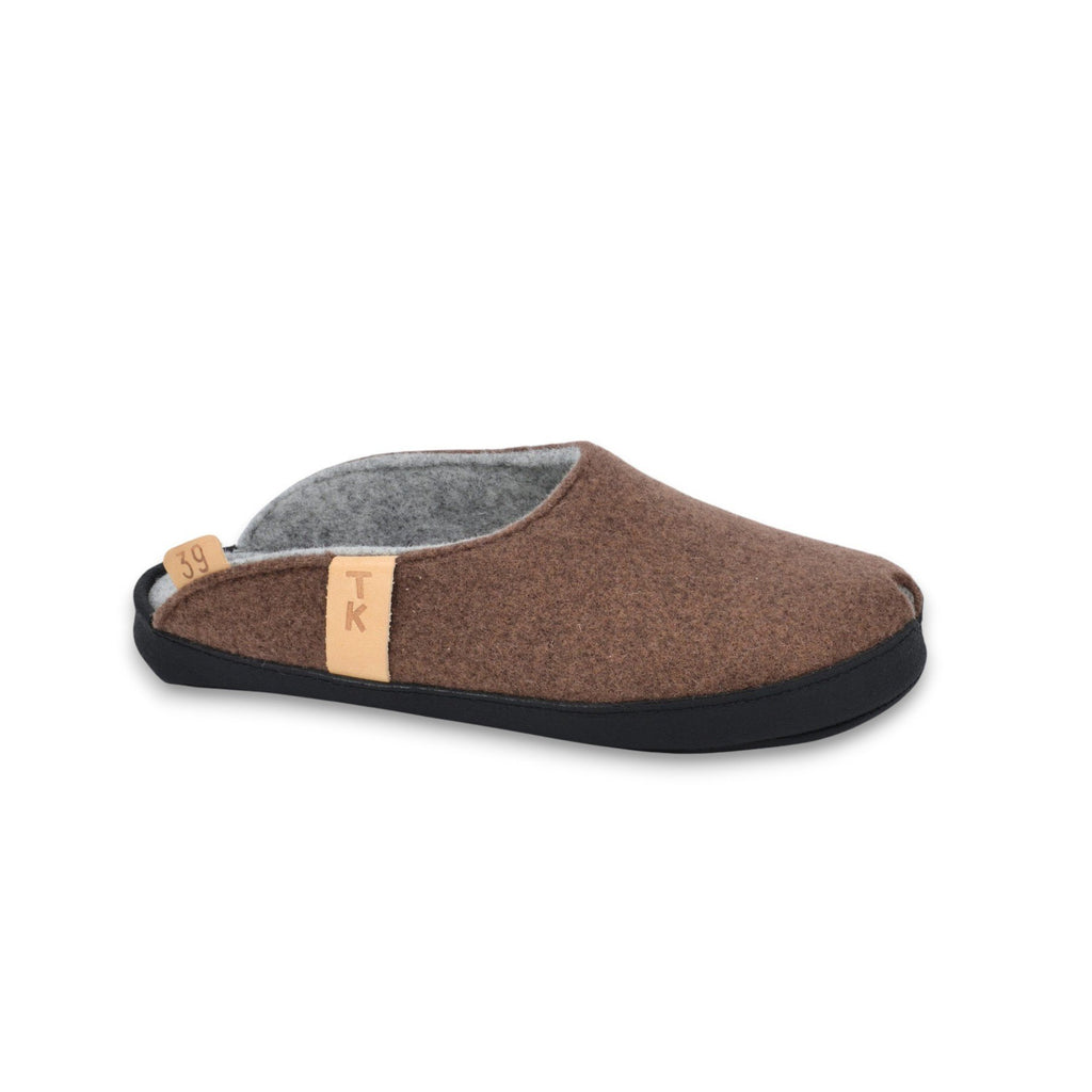 2. Brown lambswool felt slippers with black microfibre sole, side view showing arch support and TK logo tag