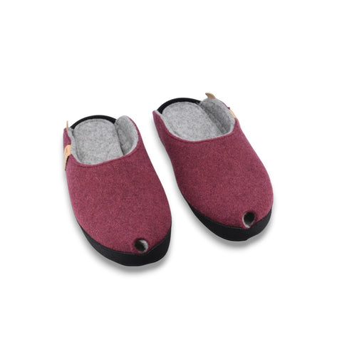 2. Pair of burgundy lambswool felt slippers with black microfibre sole, front view highlighting rounded toe design