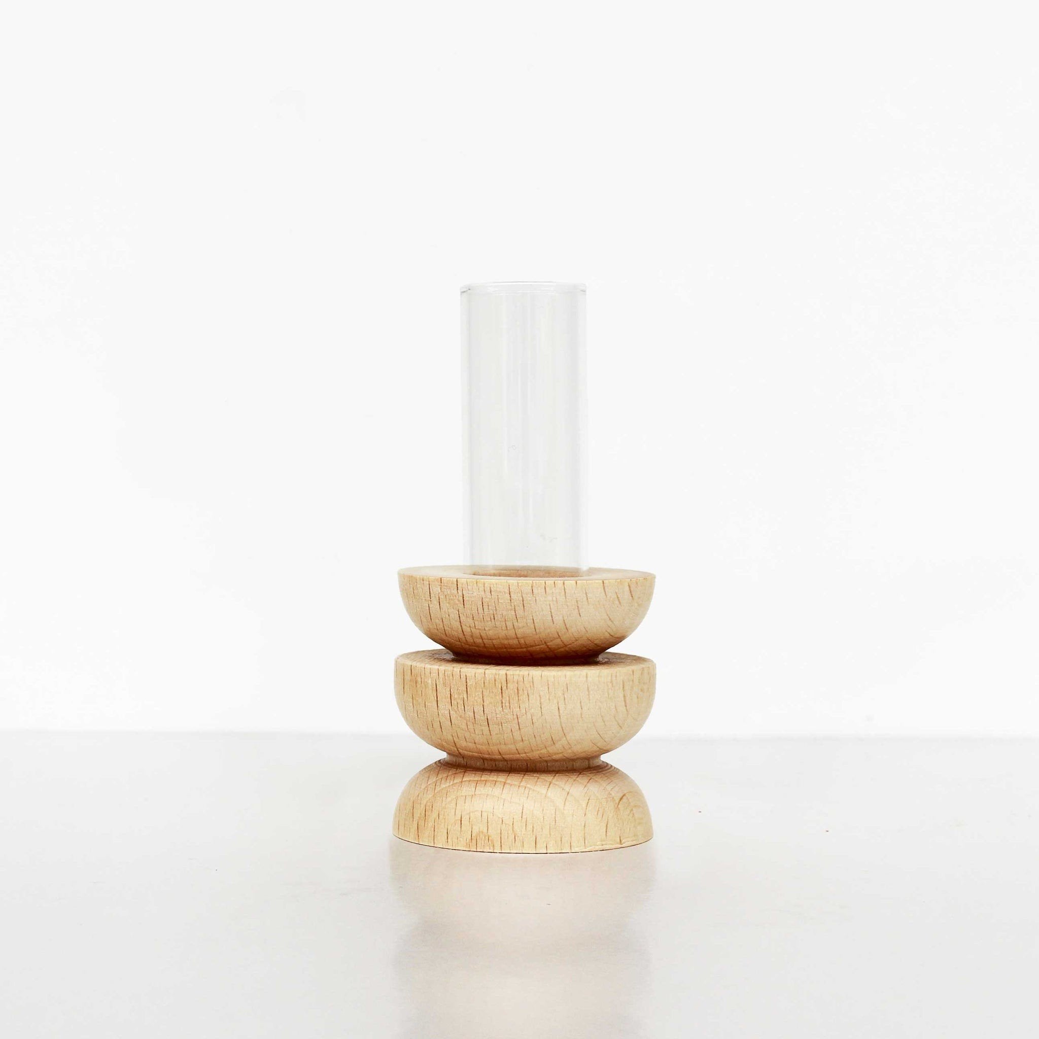4. Studio image of Totem Wooden Vase - Short Nº 4 by 5mm Paper showing beech wooden base and glass tube