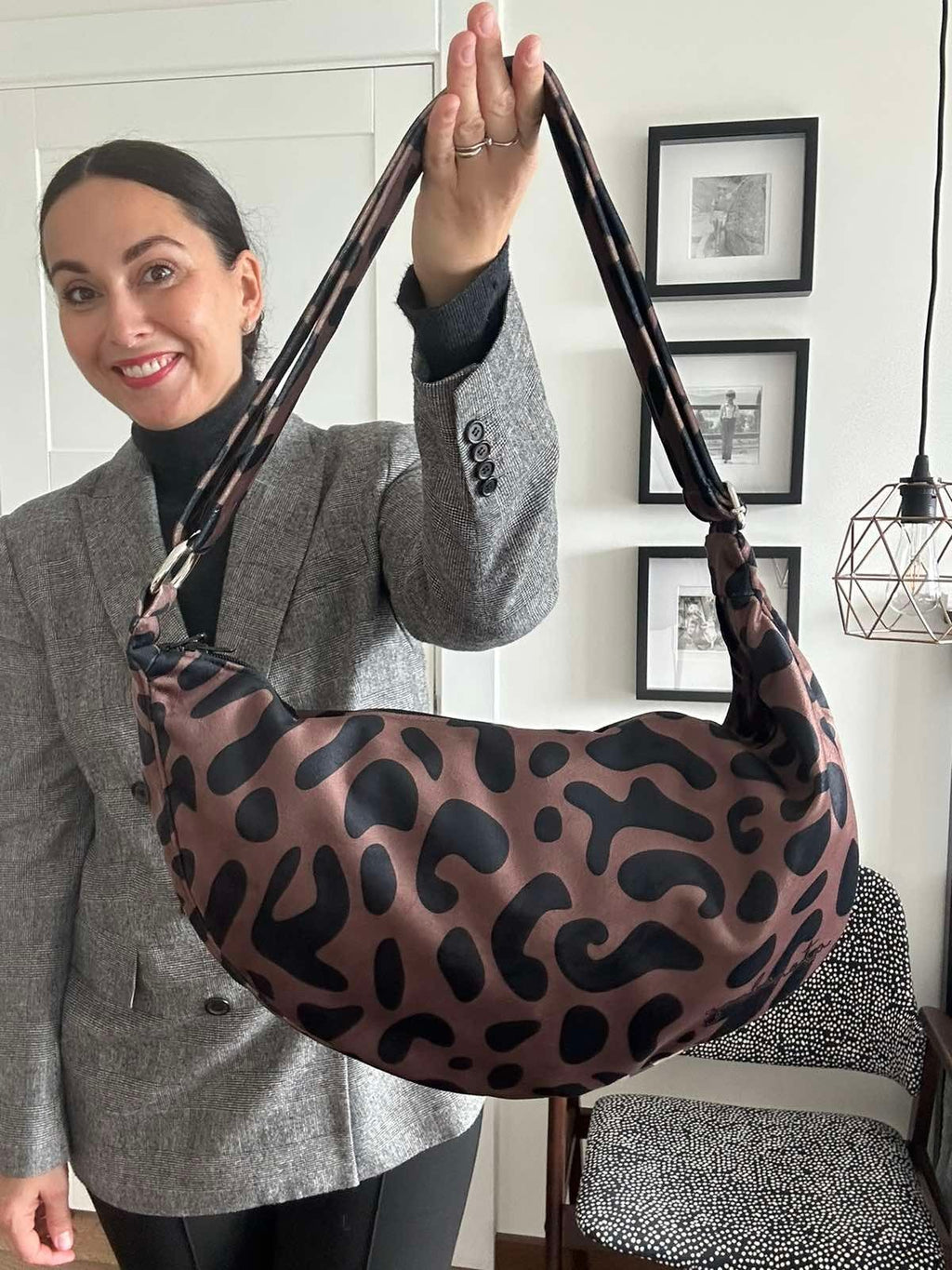 4. Studio shot of Garbanota Classic Leopard Hobo Bag on display, showing leopard print and adjustable strap