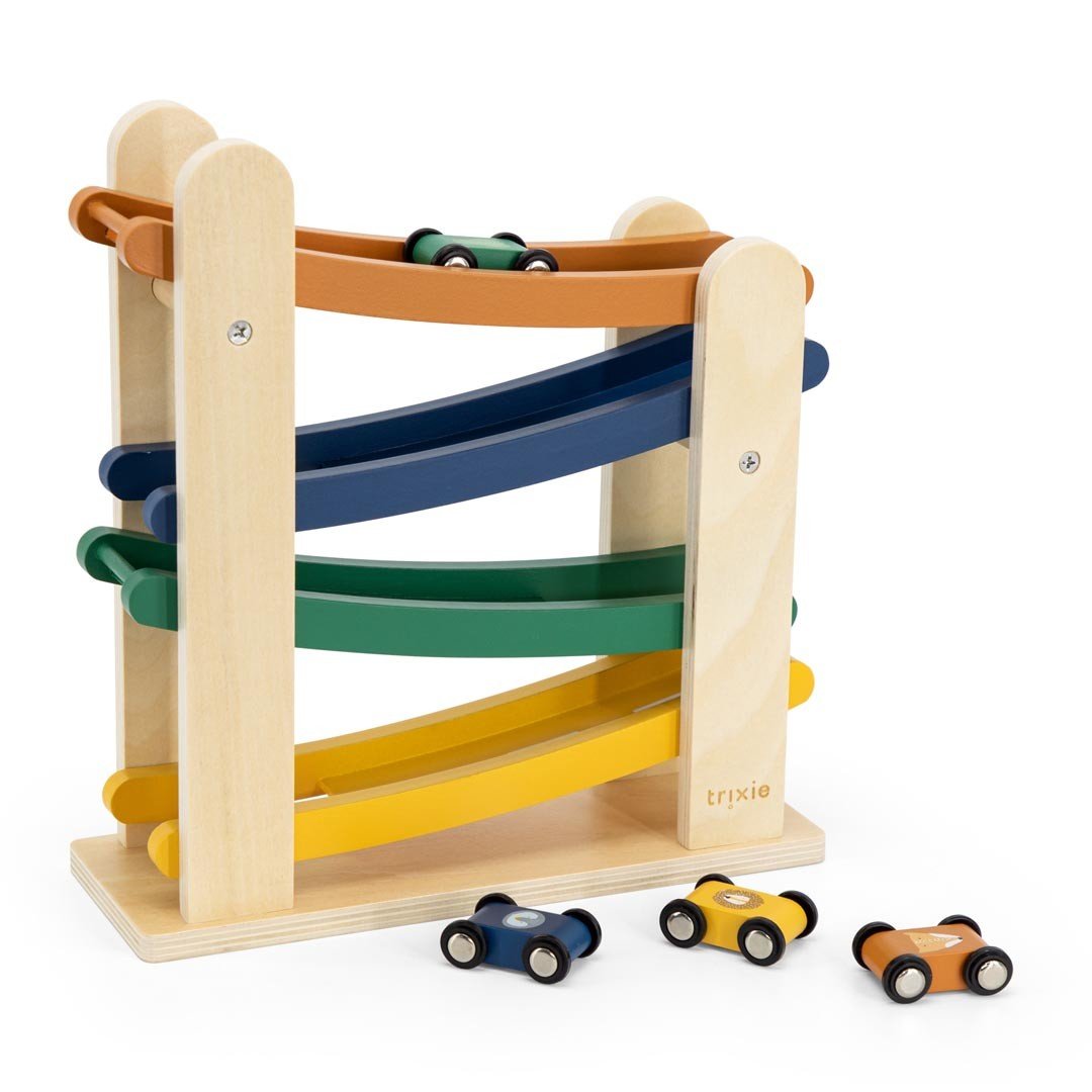 2. Side view of Trixie Baby wooden race track with four animal-themed cars on a white background
