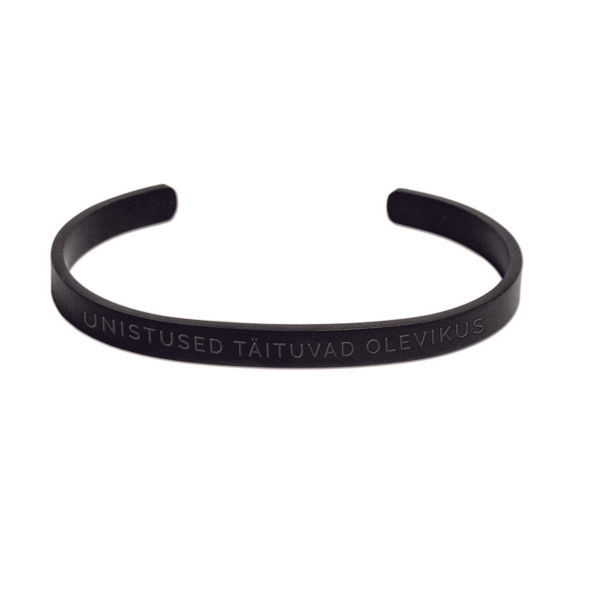 2. Black Olla x Lauri Räpp bracelet with engraved text 'UNISTUSED TÄITUVAD OLEVIKUS' on white background