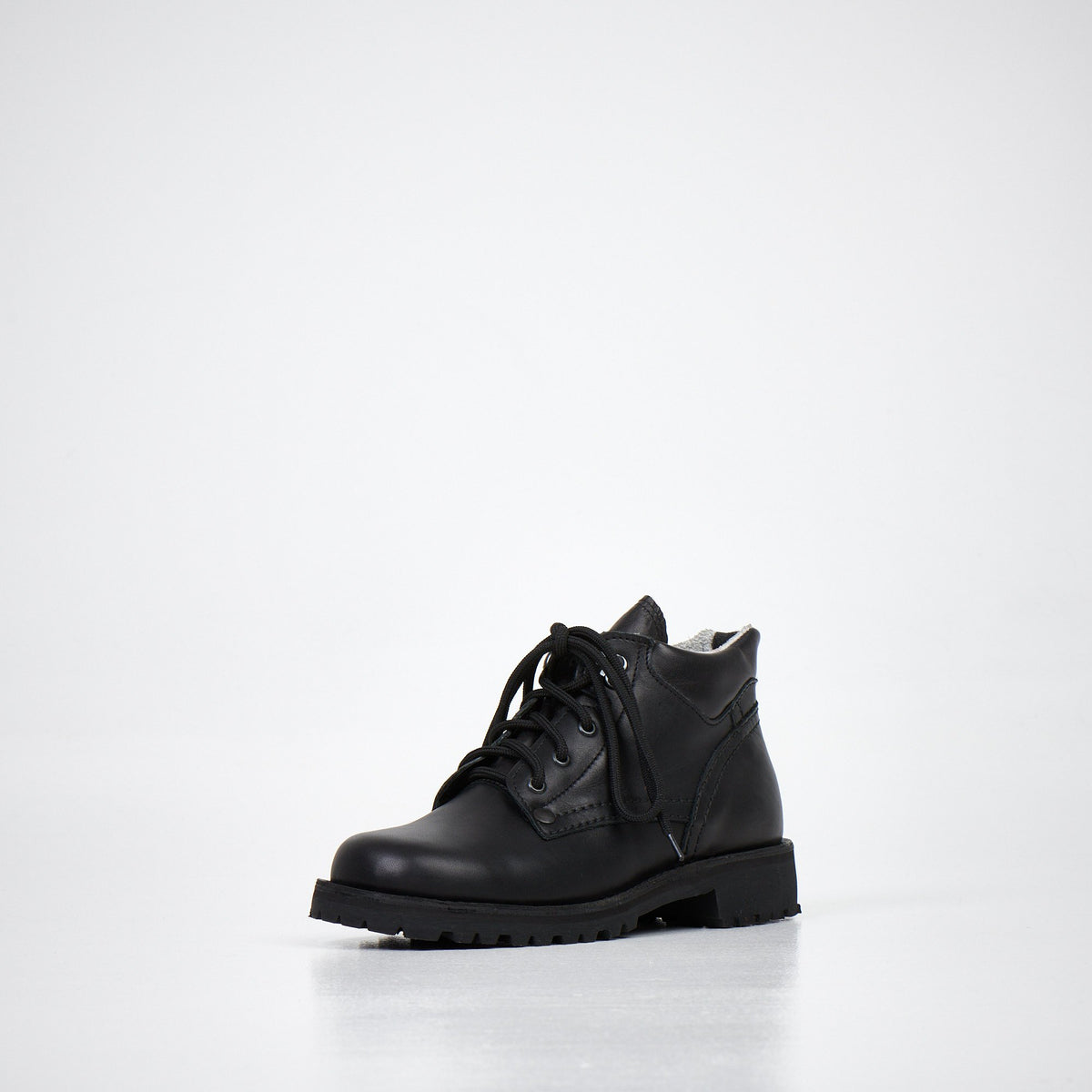2. Back view of AIPI Handmade Ankle Boots in black leather, highlighting the heel and sole design