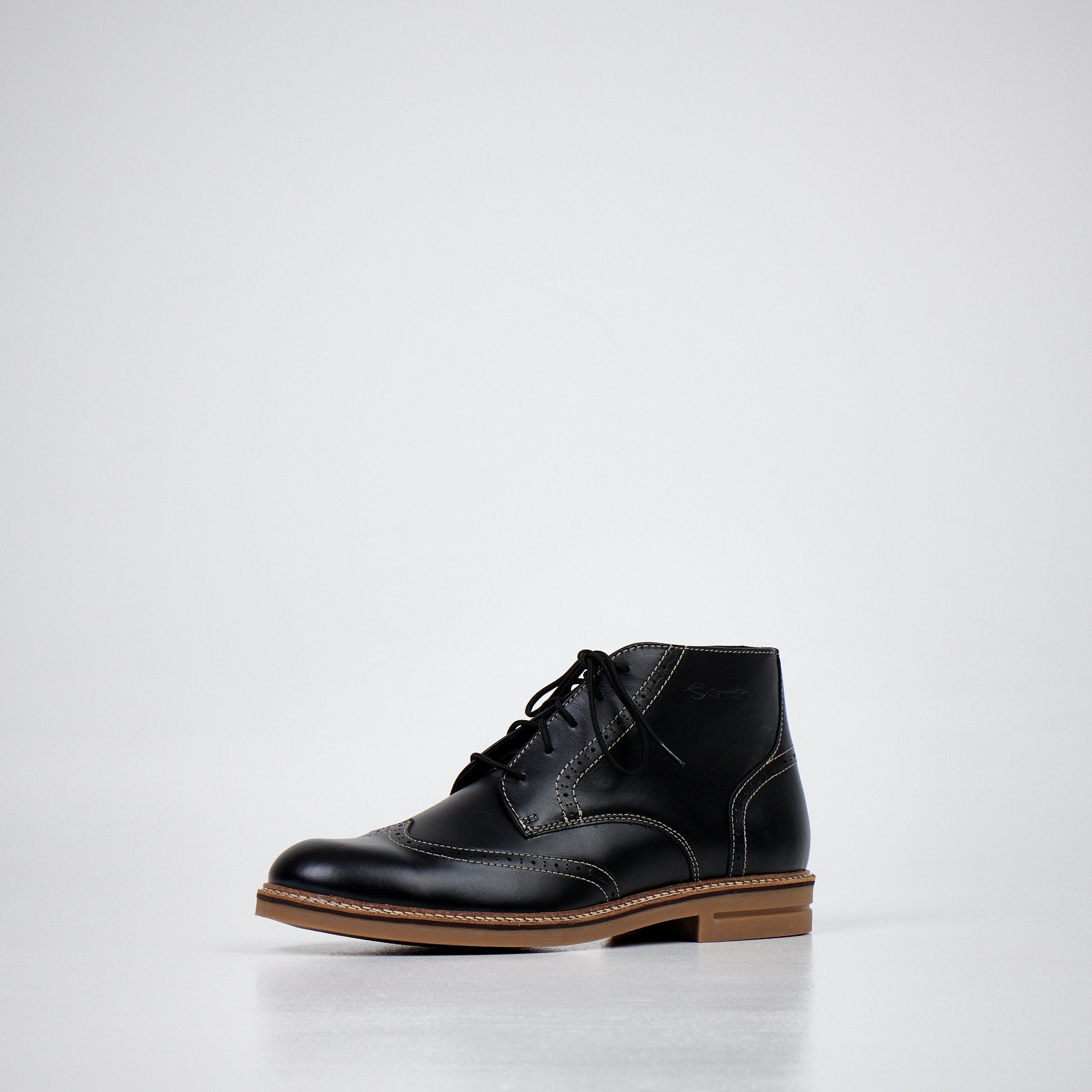 1. Men's dark brown ankle boots by Samelin in studio setting, featuring water-repellent dyed natural leather and decorative stitching