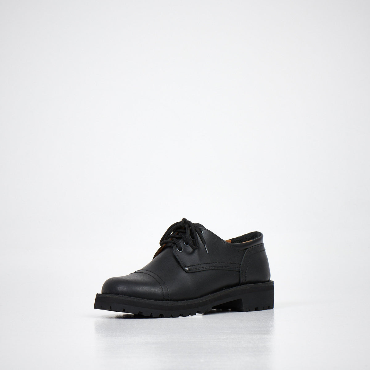 2. Unisex AIPI handmade leather shoes in black, angled front view highlighting natural leather upper and lace-up design, studio setting