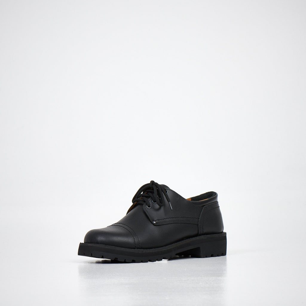 2. Unisex AIPI handmade leather shoes in black, angled front view highlighting natural leather upper and lace-up design, studio setting