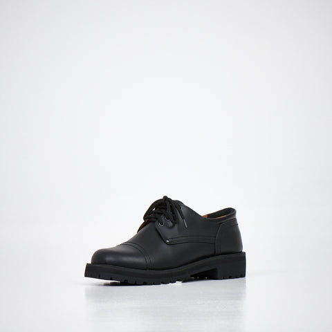 2. Unisex AIPI handmade leather shoes in black, angled front view highlighting natural leather upper and lace-up design, studio setting