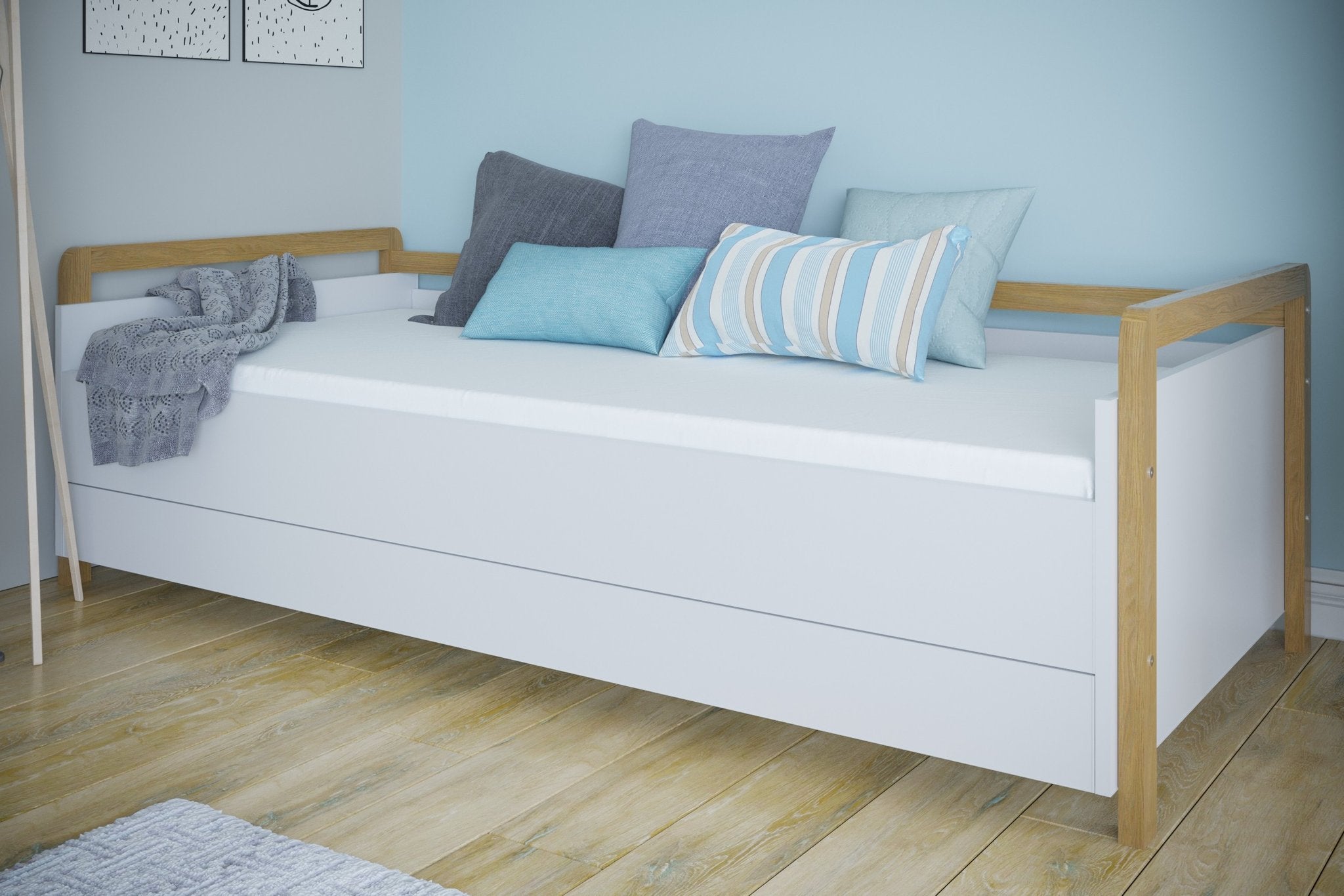 1. Victor daybed with drawers in a cozy room setting with decorative pillows, emphasizing comfort and style