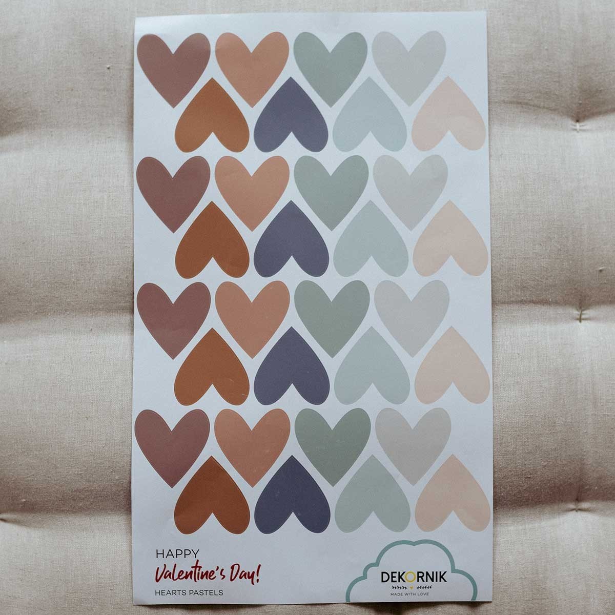 5. Sheet of Dekornik heart wall stickers in cappuccino and blue on cushioned surface