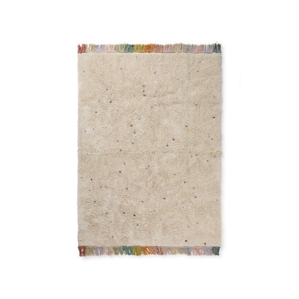 2. Studio shot of Lorena Canals Stardust washable rug in natural color with dark dots and multicolored fringes, 120 x 160 cm