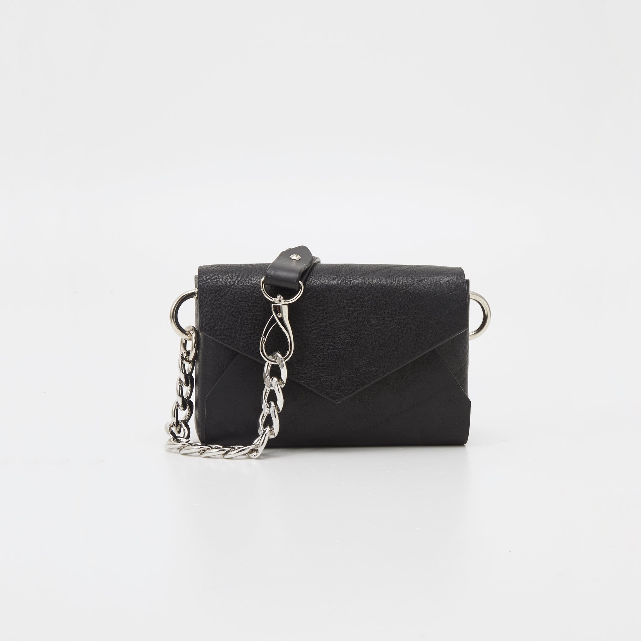 3. Studio image of handmade black leather envelope bag by Daz Studio with chain detail and silver magnet closure
