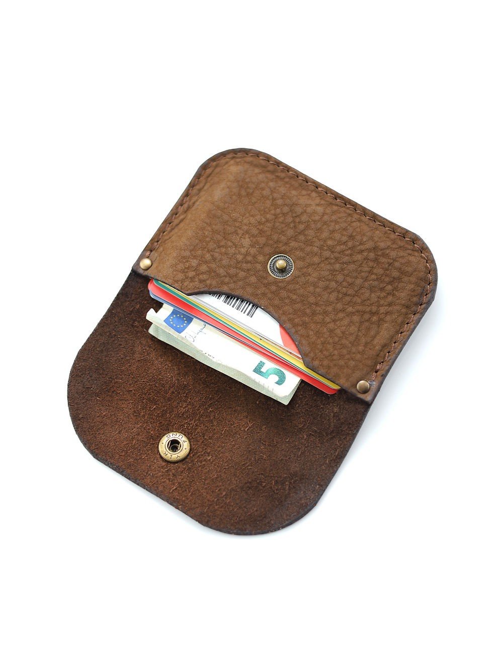 6. Open brown nubuck leather wallet showing cards and cash inside with brass button closure